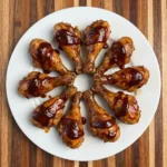 baked bbq chicken drumsticks on white plate