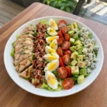 Classic Cobb Salad on a white ceramic rimmed salad plate