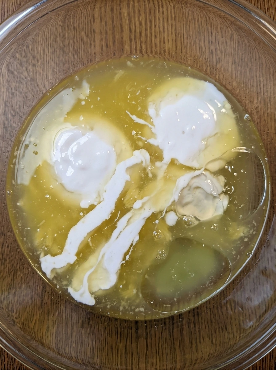 Measured pineapple juice coconut cream syrup and lime juice in a bowl