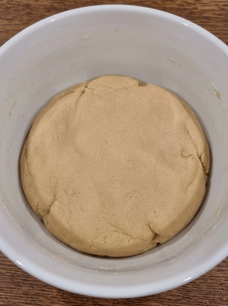 Soft cookie dough mixed in a white ceramic bowl