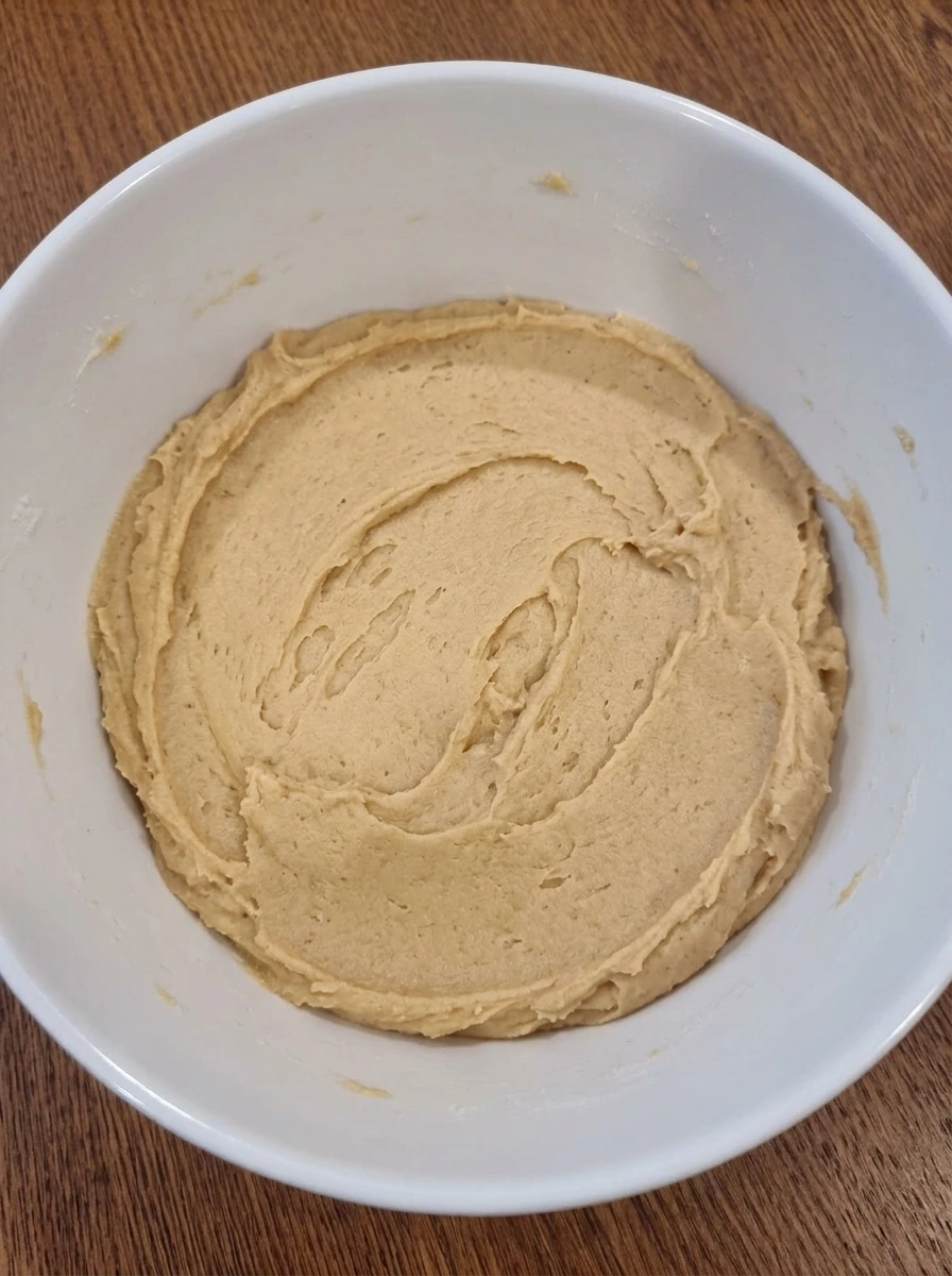 Soft peanut butter cookie dough in a white bowl