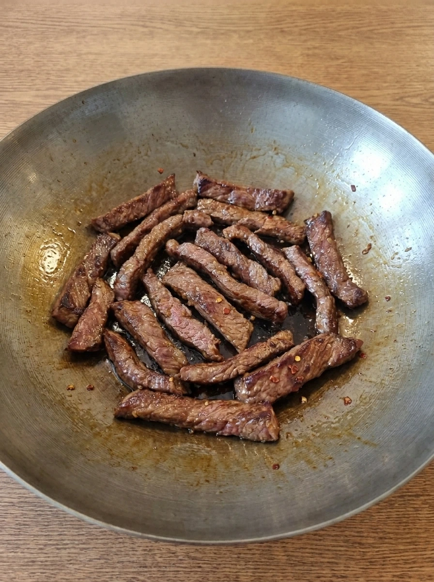 Beef strips browning in the wok for Beef and Broccoli.