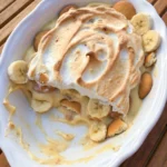 Classic Banana Pudding in a white oval serving dish with creamy layers and toasted meringue