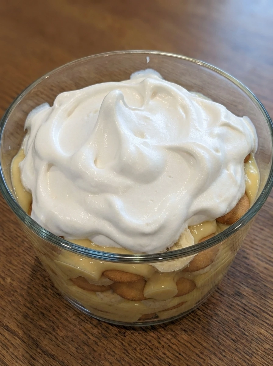 Meringue spread over layered banana pudding
