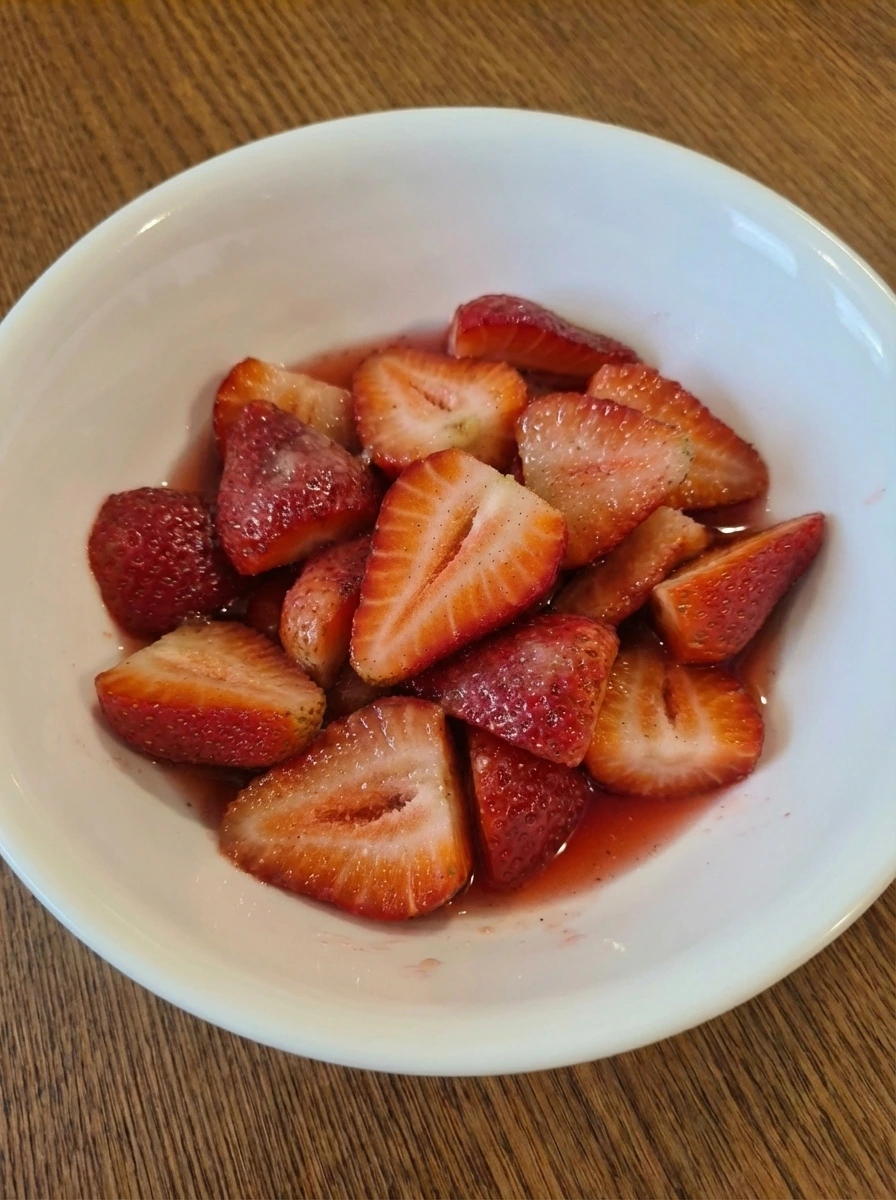 Strawberries softened in syrup for shortcake filling