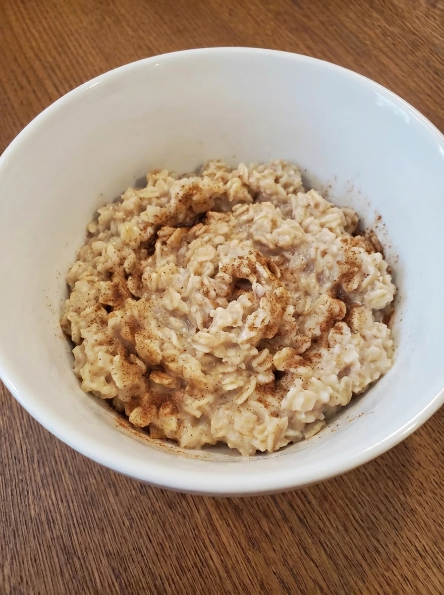 Oatmeal softening with cinnamon swirled through in a natural white dish