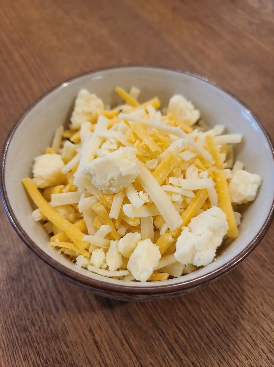 Mixed cheddar and mozzarella prepared for grilled cheese
