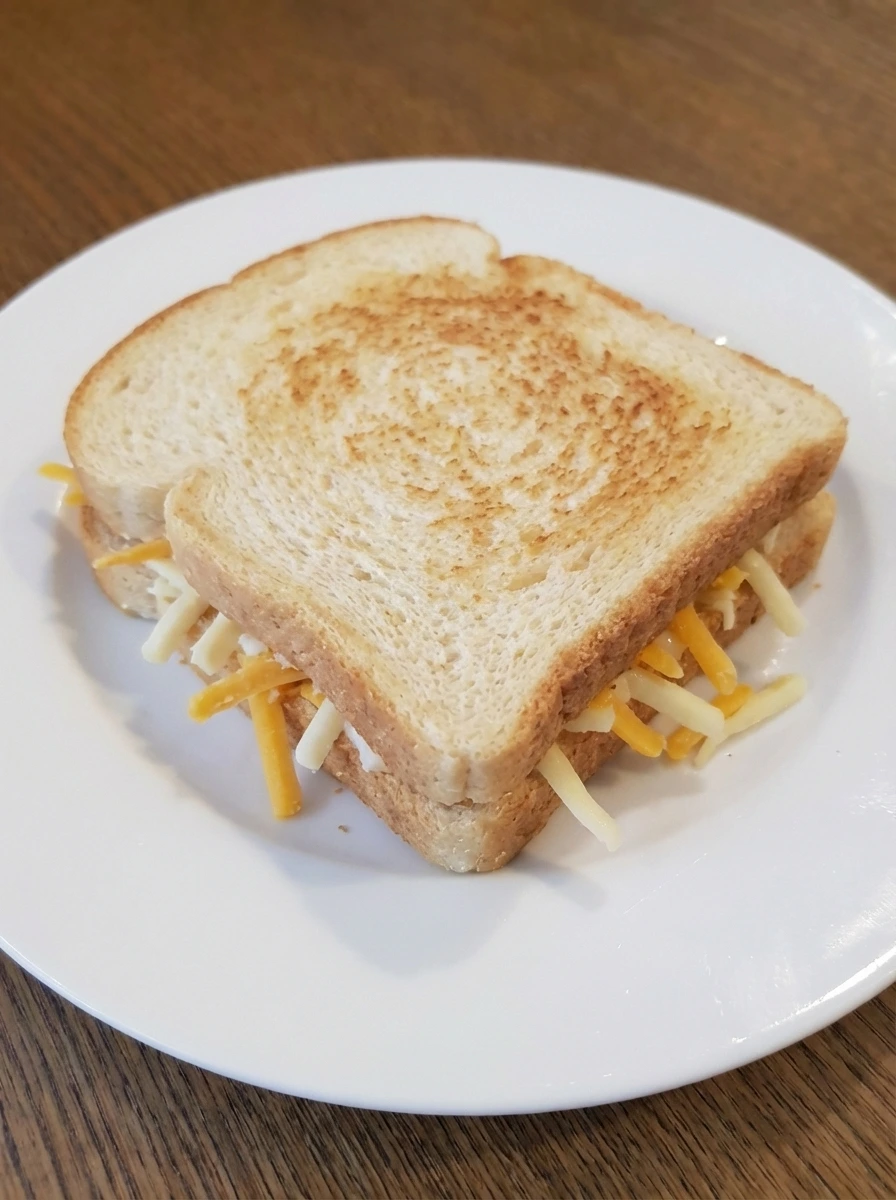 Grilled cheese after the first side starts to turn golden
