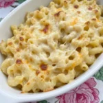 Crockpot Mac and Cheese with creamy noodles melted cheese and lightly browned top.