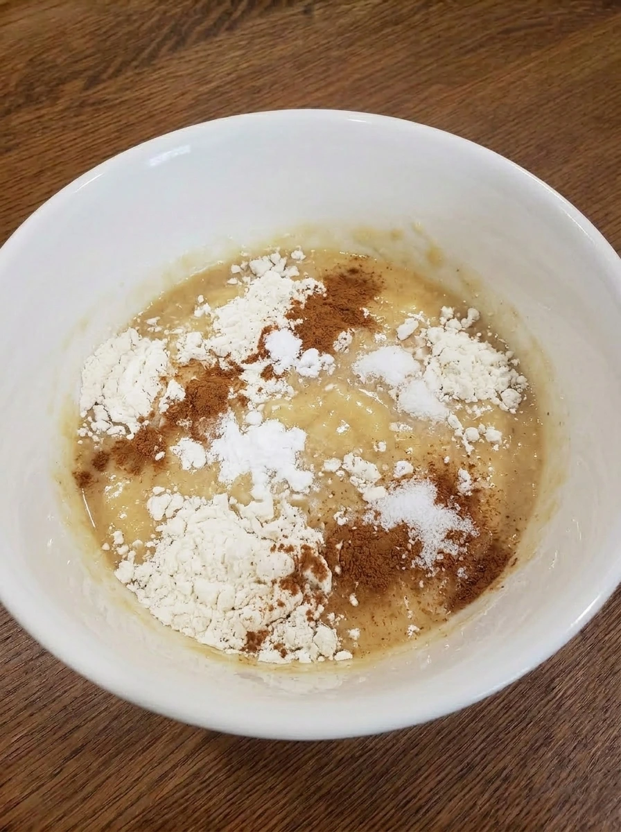 Dry ingredients added on top of wet banana bread batter.