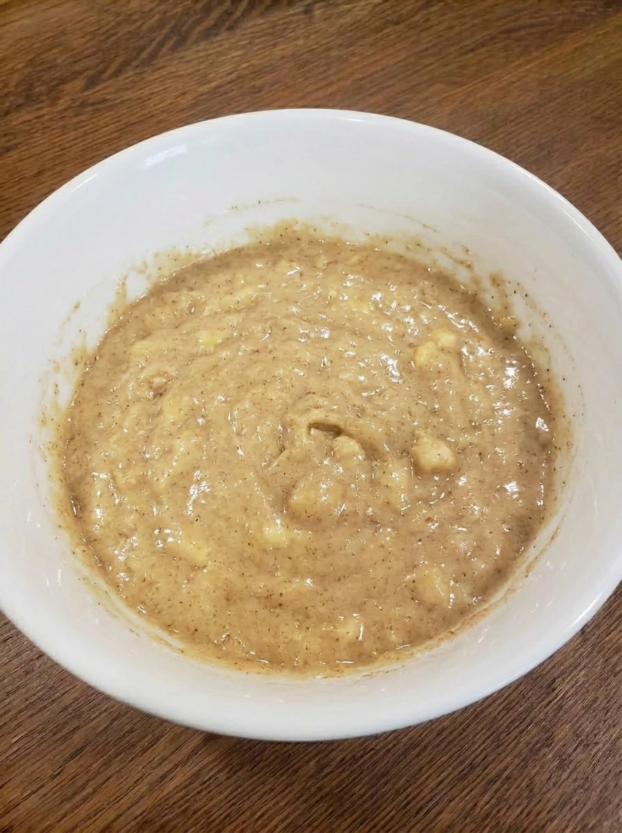 Thick banana bread batter after folding the ingredients together.