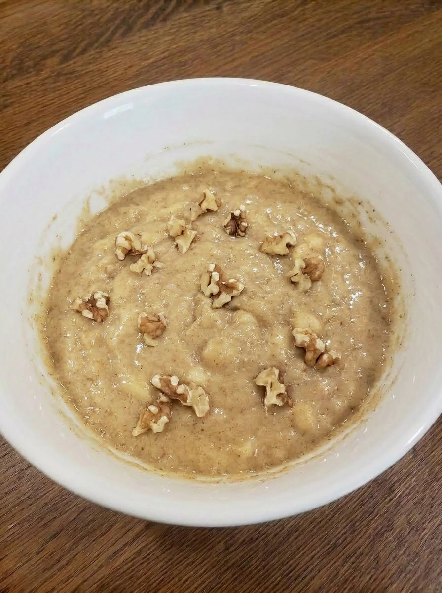 Chopped walnuts folded into banana bread batter.