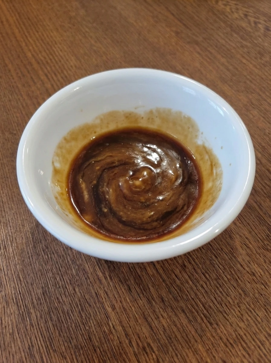 Mixed stir fry sauce in a white bowl for Easy Beef Stir Fry