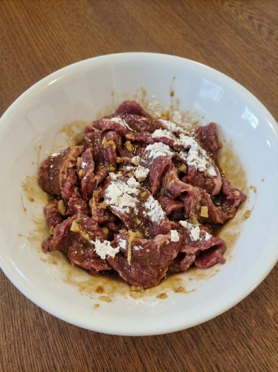 Cornstarch coated marinated beef strips for Easy Beef Stir Fry