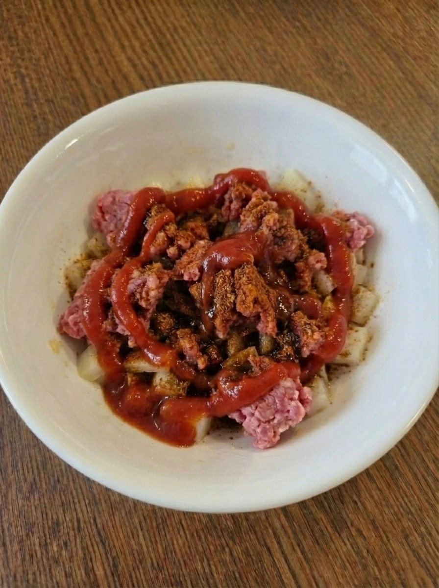 Sauce base poured over seasoned ground beef for Easy Ground Beef Tacos