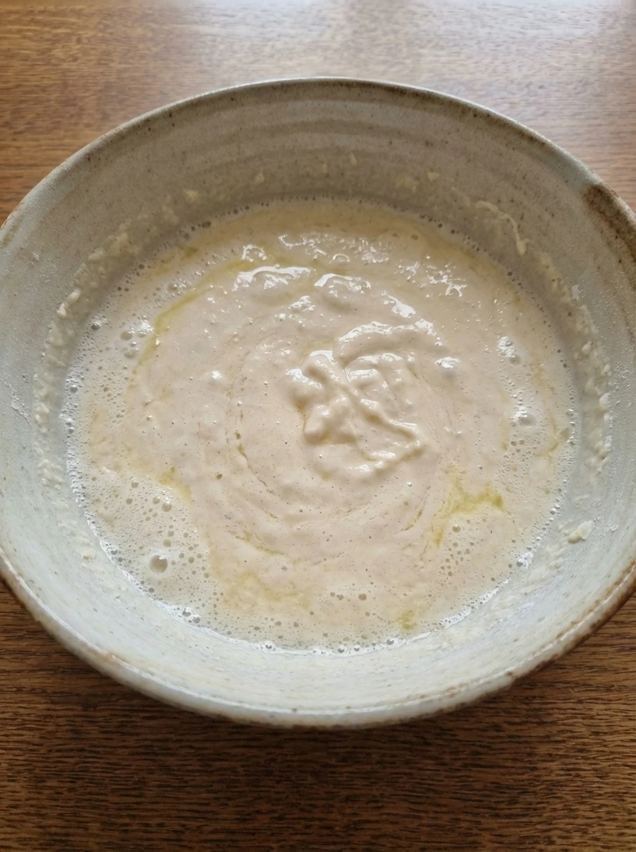 Wet ingredients whisked together for Fluffy Buttermilk Pancakes