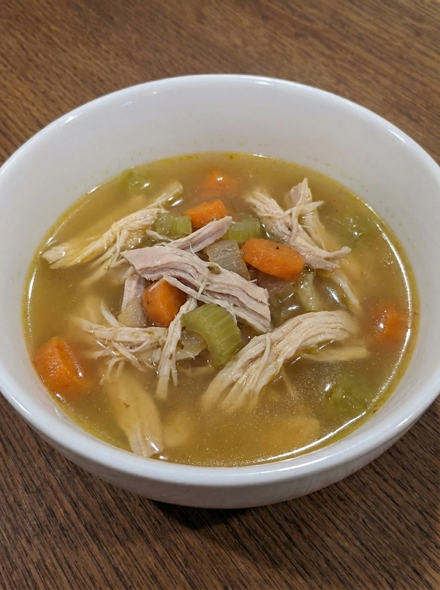 Shredded chicken returned to the soup broth