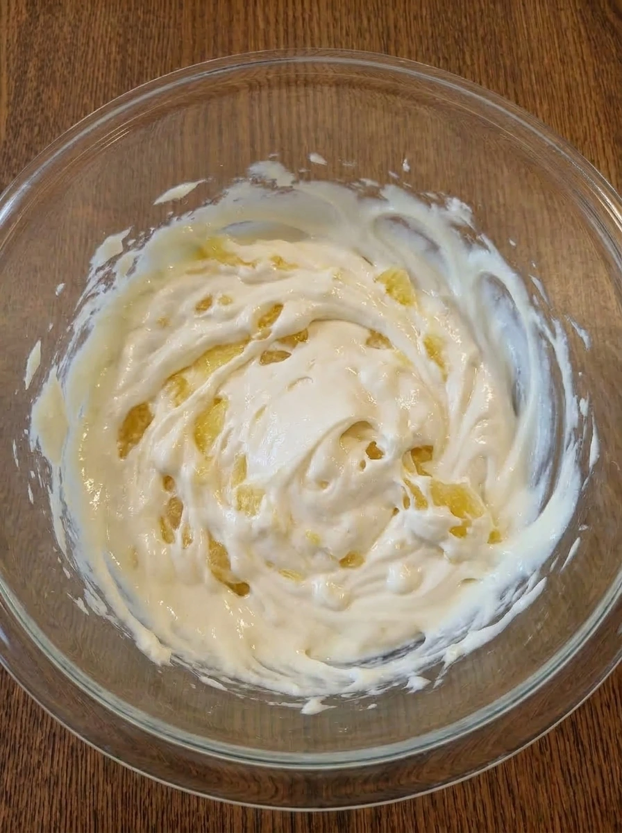 Crushed pineapple folded into the cream cheese base for Pineapple Cheesecake Dip.