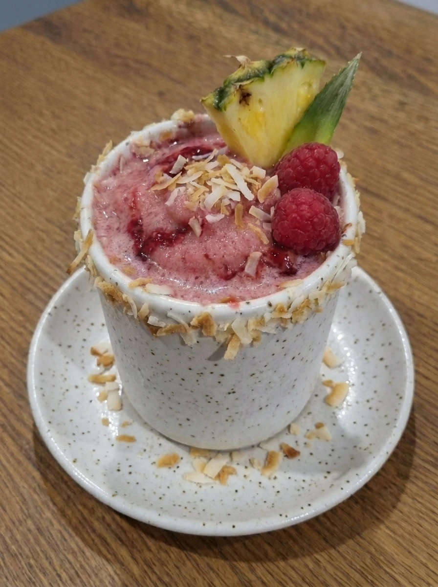 Finished Raspberry Pina Colada Cocktail plated and ready to serve