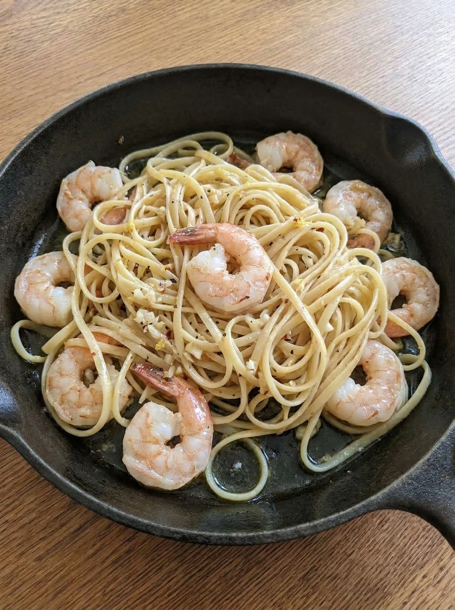Linguine tossed with shrimp in garlic lemon butter sauce.