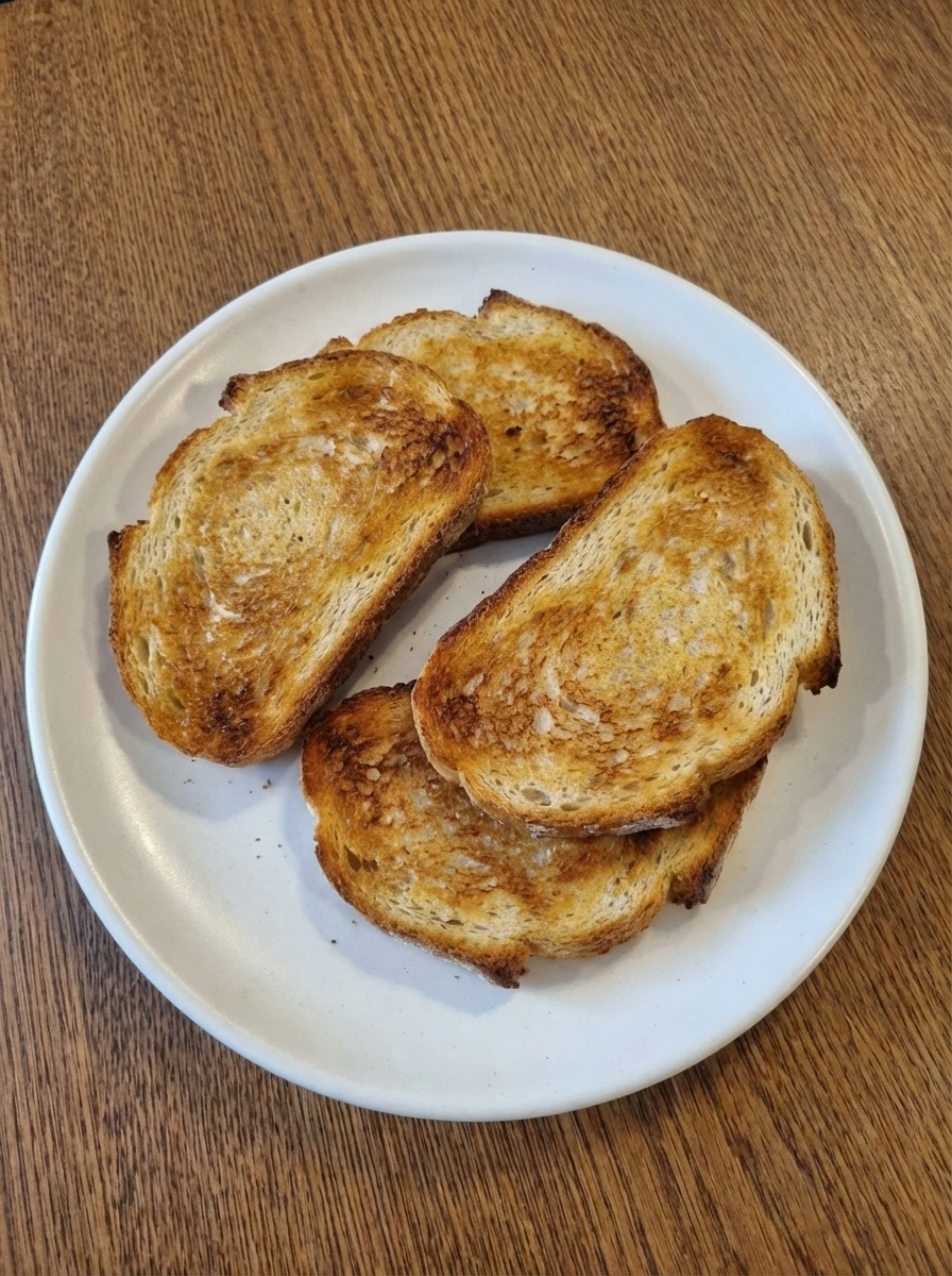 Bread slices toasted until golden for Simple Avocado Toast