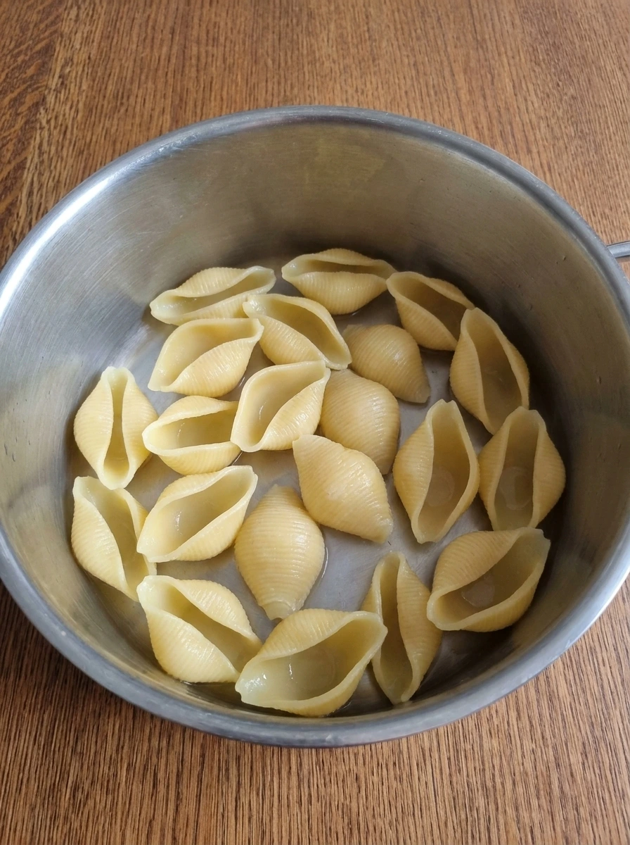 Cooked jumbo pasta shells softened and ready to be filled.