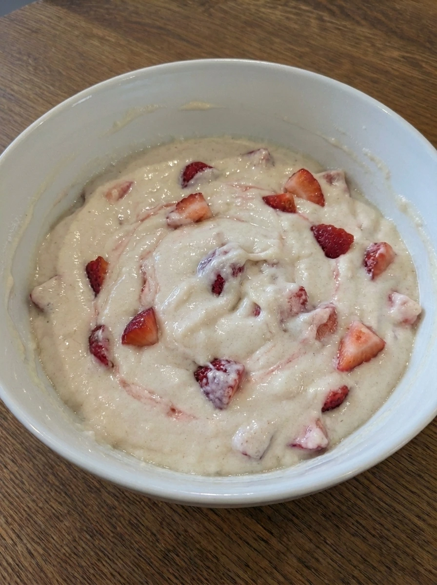 Strawberries folded into muffin batter