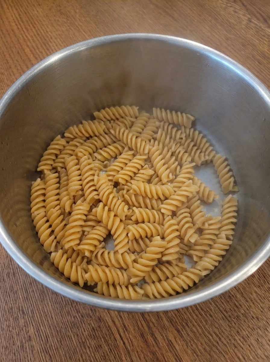 Cooked rotini pasta for Street Corn Pasta Salad in a large pot.
