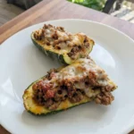 Stuffed zucchini boats with ground beef and melted cheese