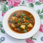 Crockpot Fall Soups with browned beef, potatoes, beans, corn, carrots and green beans in tomato broth Recipe focus: fall soups crockpot.