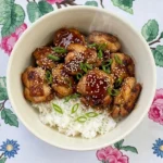 Crockpot Teriyaki Chicken with glossy glazed chicken pieces over rice Recipe focus: crockpot teriyaki chicken easy.