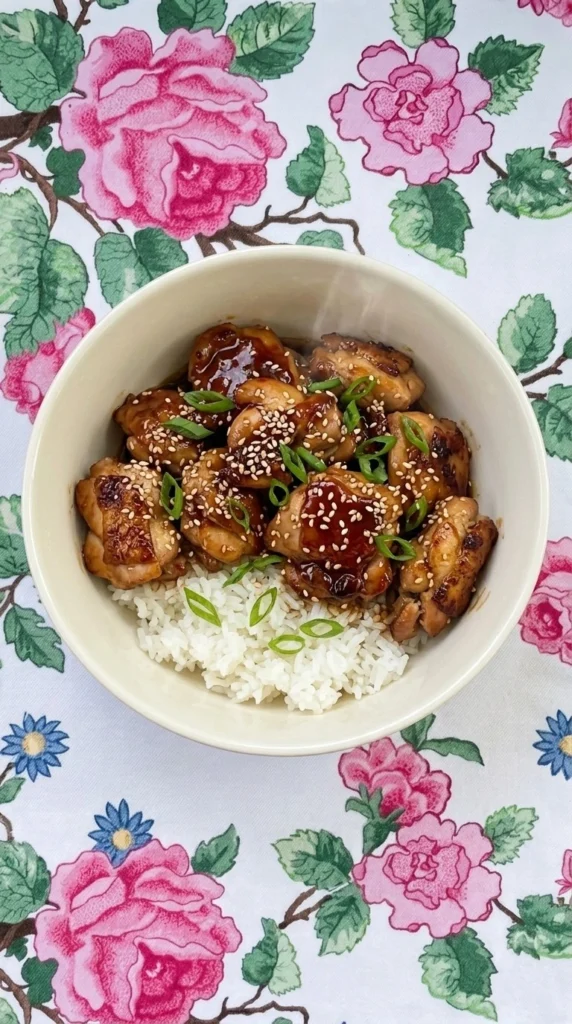 Crockpot Teriyaki Chicken with glossy glazed chicken pieces over rice Recipe focus: crockpot teriyaki chicken easy.