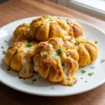 Halloween Appetizers Pumpkin golden pumpkin shaped pizza bites on a plate