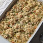 Chicken Pot Pie Casserole with golden biscuit topping and creamy filling Recipe focus: chicken pot pie recipe with biscuits.