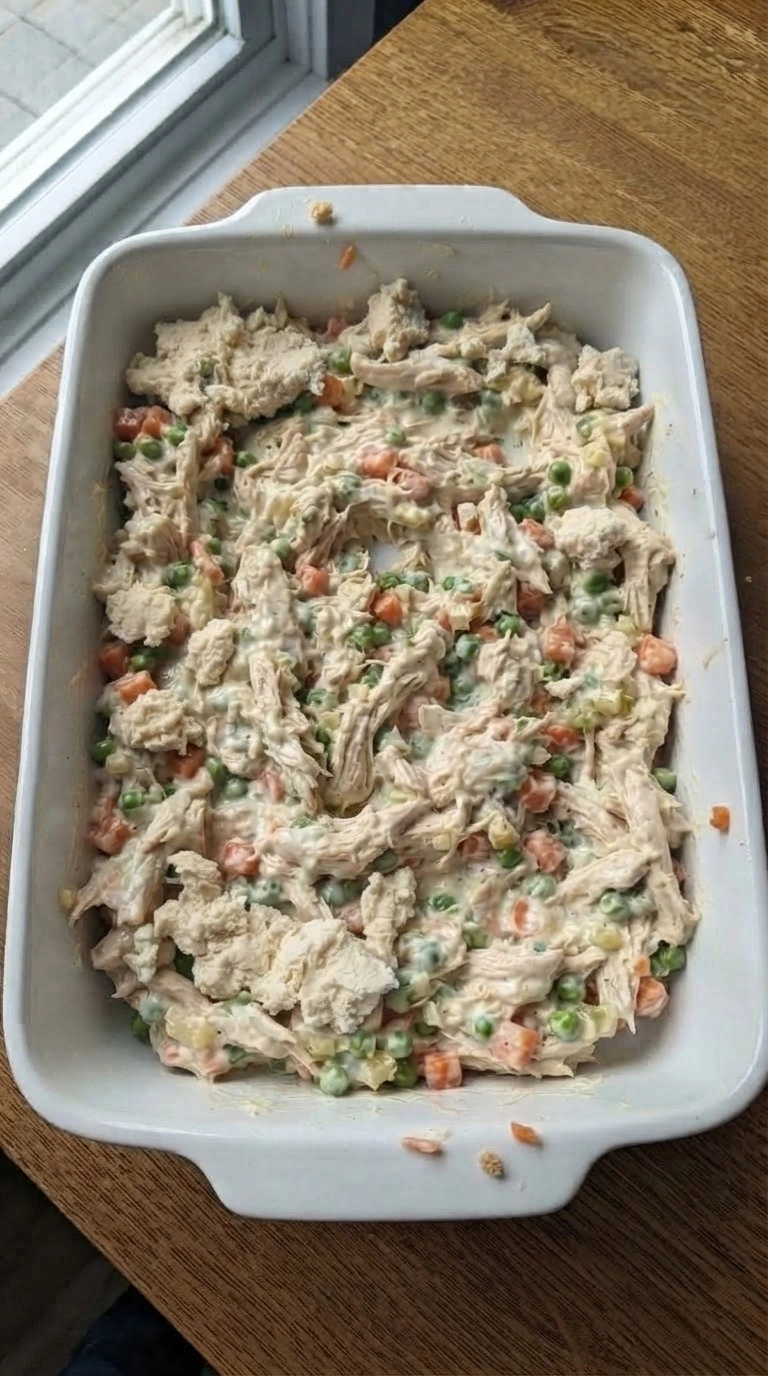 Chicken Pot Pie Casserole biscuit topping added over creamy filling Recipe focus: chicken pot pie recipe with biscuits.