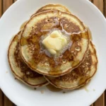 Fluffy Buttermilk Pancakes from Scratch stacked with melting butter and maple syrup Recipe focus: homemade pancakes from scratch.