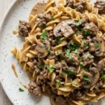 Ground Beef Stroganoff creamy noodles with browned beef and mushroom sauce Recipe focus: beef stroganoff recipe. Recipe focus: beef stroganoff with ground beef.
