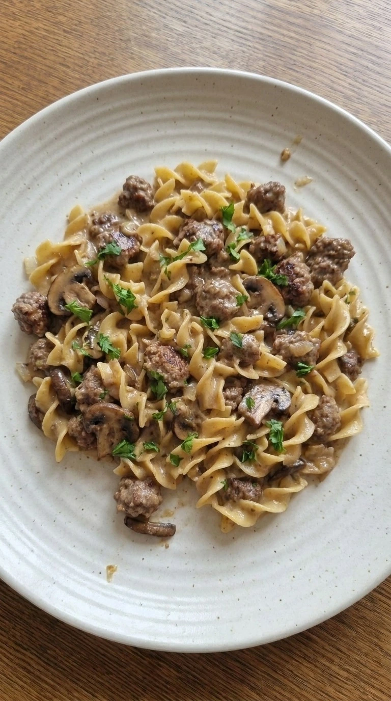 Ground Beef Stroganoff plated portion with creamy noodles and beef Recipe focus: beef stroganoff with ground beef. Recipe focus: ground beef stroganoff recipe.