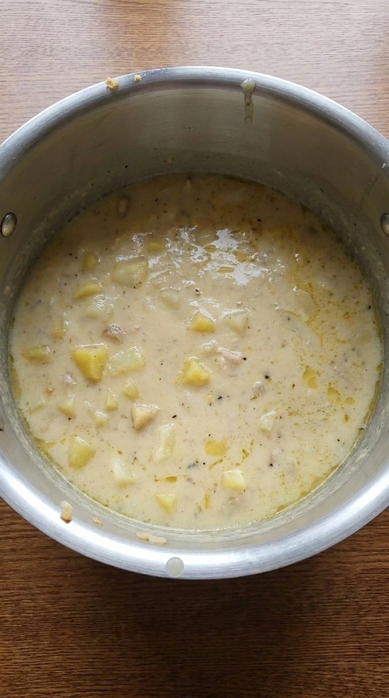 Loaded Baked Potato Soup with melted cheddar cheese stirred into base Recipe focus: loaded potato soup.