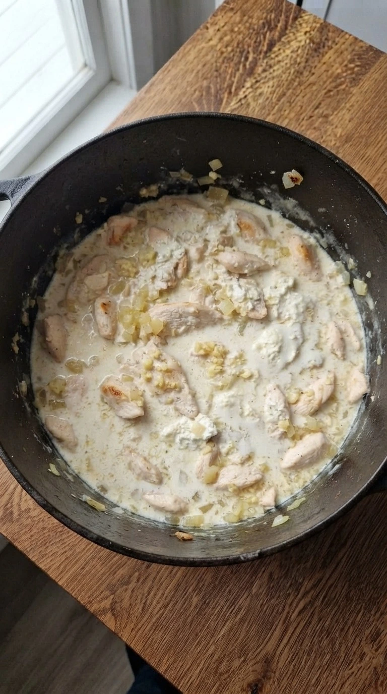 White Chicken Lasagna Soup creamy broth forming with chicken and dairy Recipe focus: white lasagna soup.