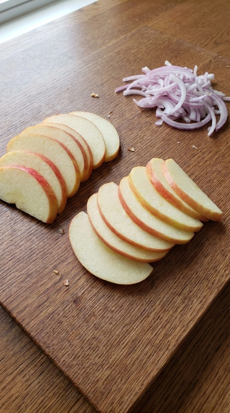 Apple Cranberry Salad preparation with thin Honeycrisp apple slices and fine red onion slivers Recipe focus: apple cranberry salad recipe.