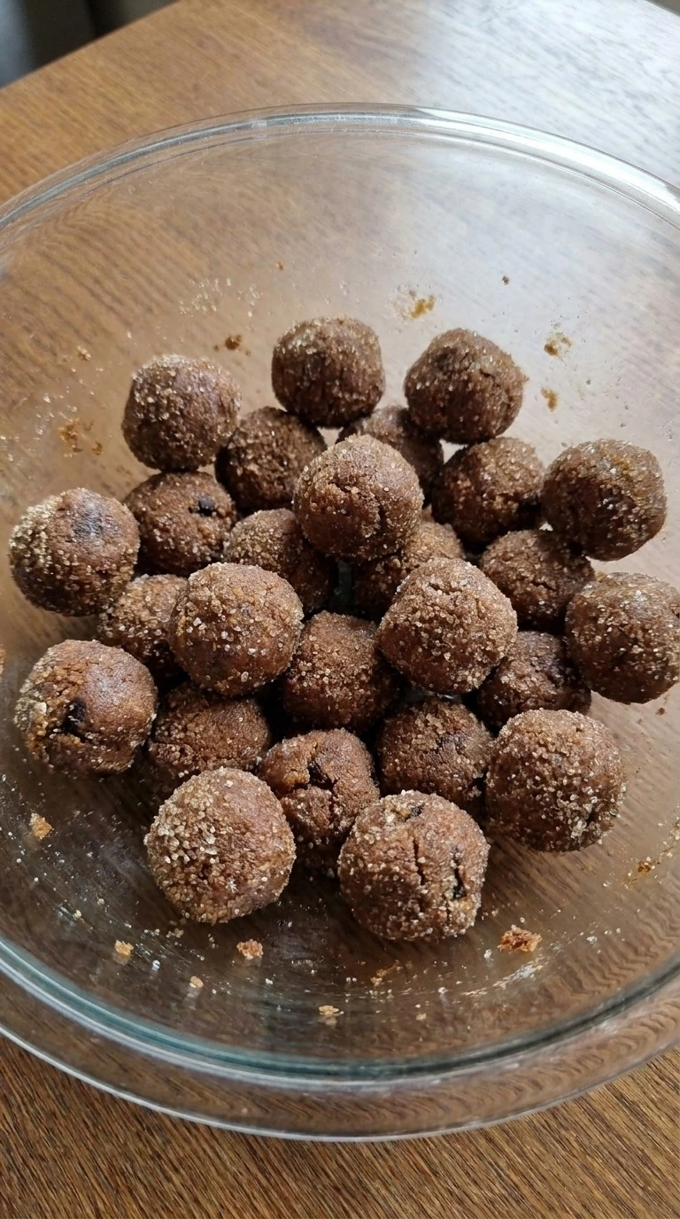 Chewy Gingerbread Cookies dough balls coated with sugar before baking Recipe focus: soft and chewy gingerbread cookies.