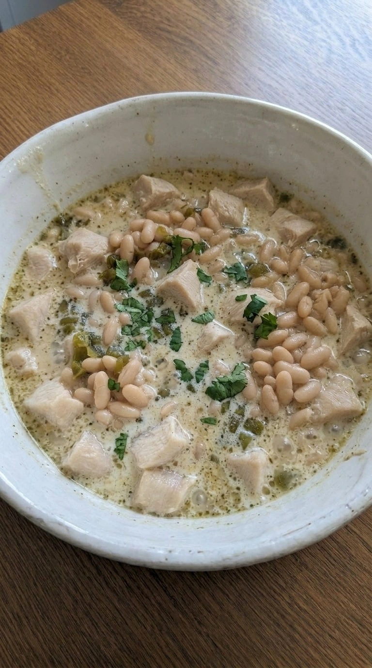 Creamy White Chicken Chili served with creamy broth chicken beans and garnish Recipe focus: easy white chicken chili.