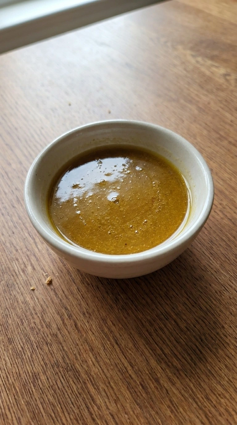 Fall Harvest Salad dressing with glossy maple mixture in bowl Recipe focus: fall salad.