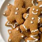 Gluten Free Gingerbread Cookies holiday cutouts on a plate with soft centers Recipe focus: gingerbread cookies gluten free.