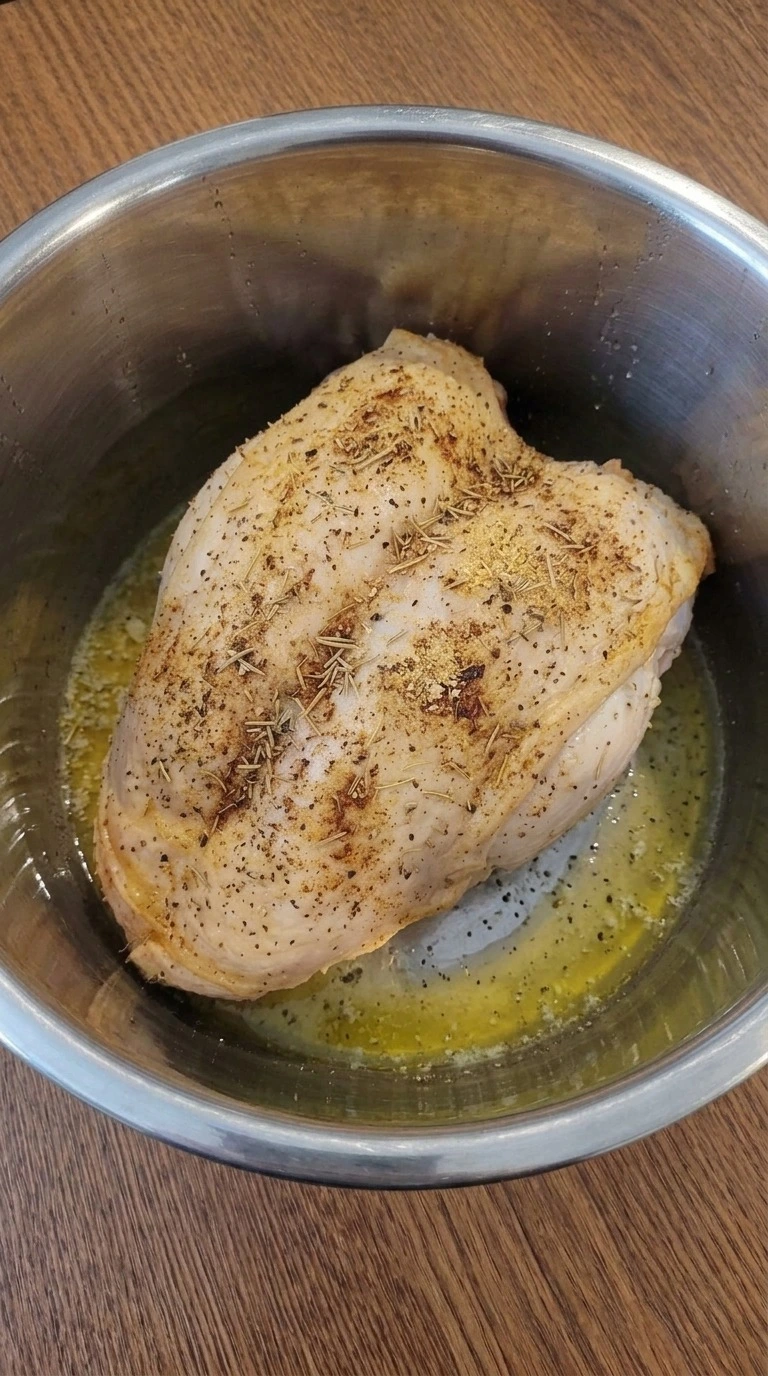 Instant Pot Turkey Breast after pressure cooking with golden broth and softened herb-seasoned skin Recipe focus: instant pot turkey breast recipe.