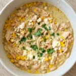Mexican Street Corn White Chicken Chili in a bowl with creamy chicken, corn and toppings Recipe focus: crockpot white chicken chili.