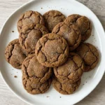 Soft Gingerbread Cookies with cracked tops on a white plate Recipe focus: soft and chewy gingerbread cookies.