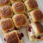 Turkey Cranberry Sliders with golden Hawaiian rolls, roasted turkey, cranberry sauce and melted Swiss cheese Recipe focus: easy turkey cranberry sliders.